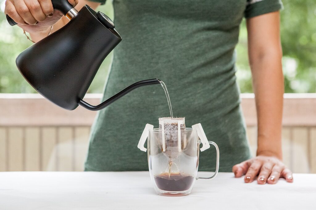 Pour-over coffee being brewed with a gooseneck kettle