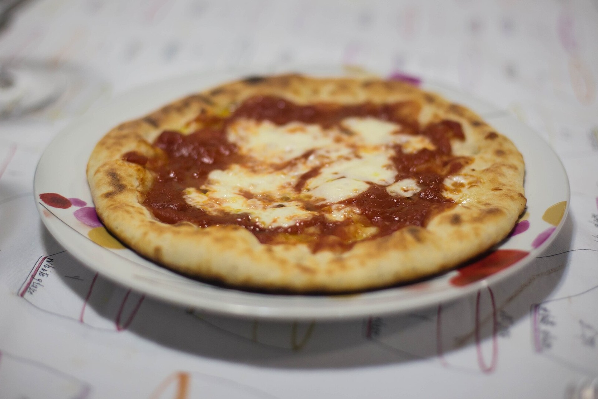 Pizza baking on a steel or stone in a home oven