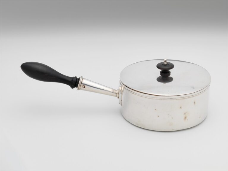 saucepans on kitchen hob