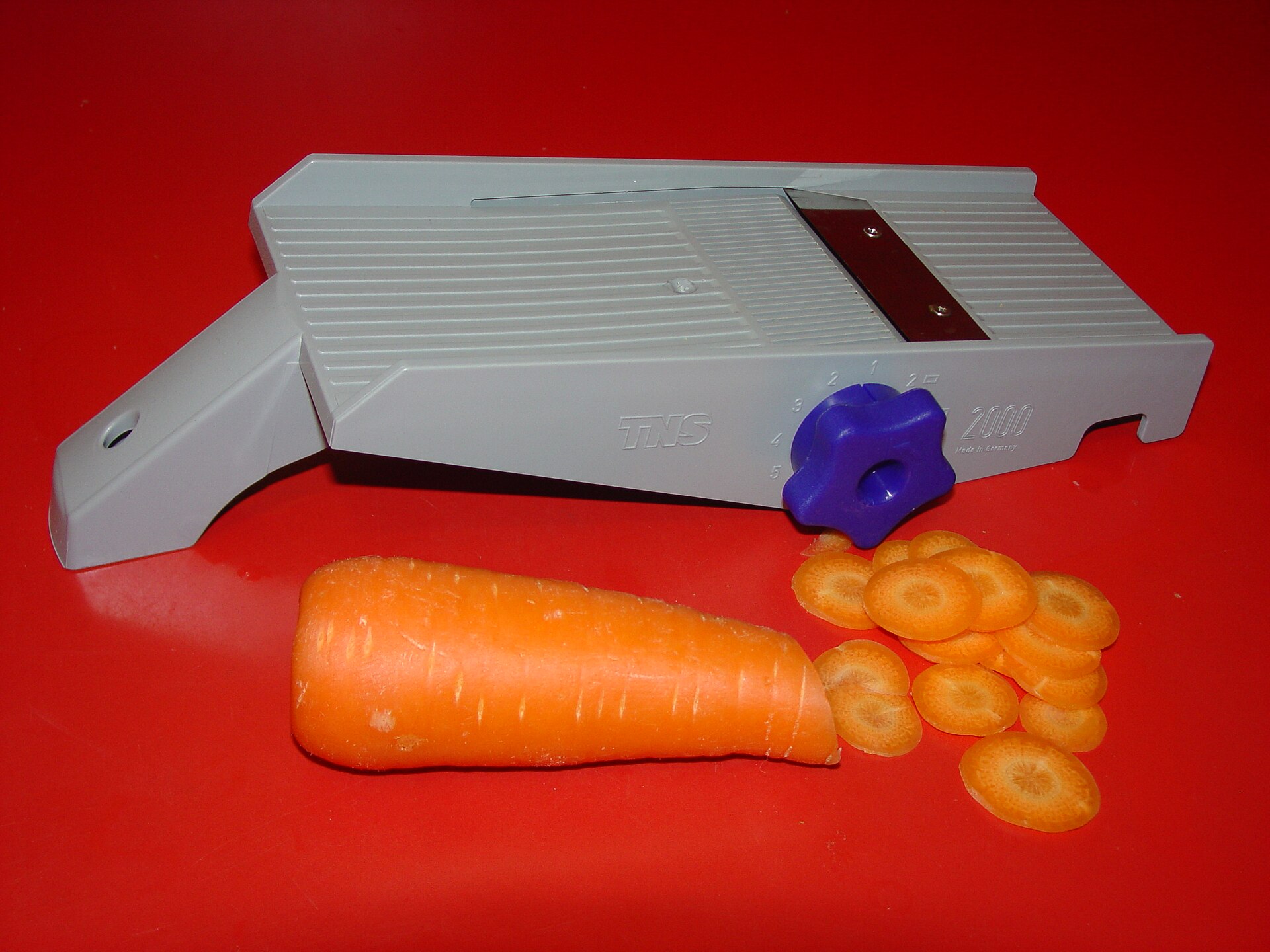 Cooking Mandolin with Carrot for mandoline slicer safety and buying guide