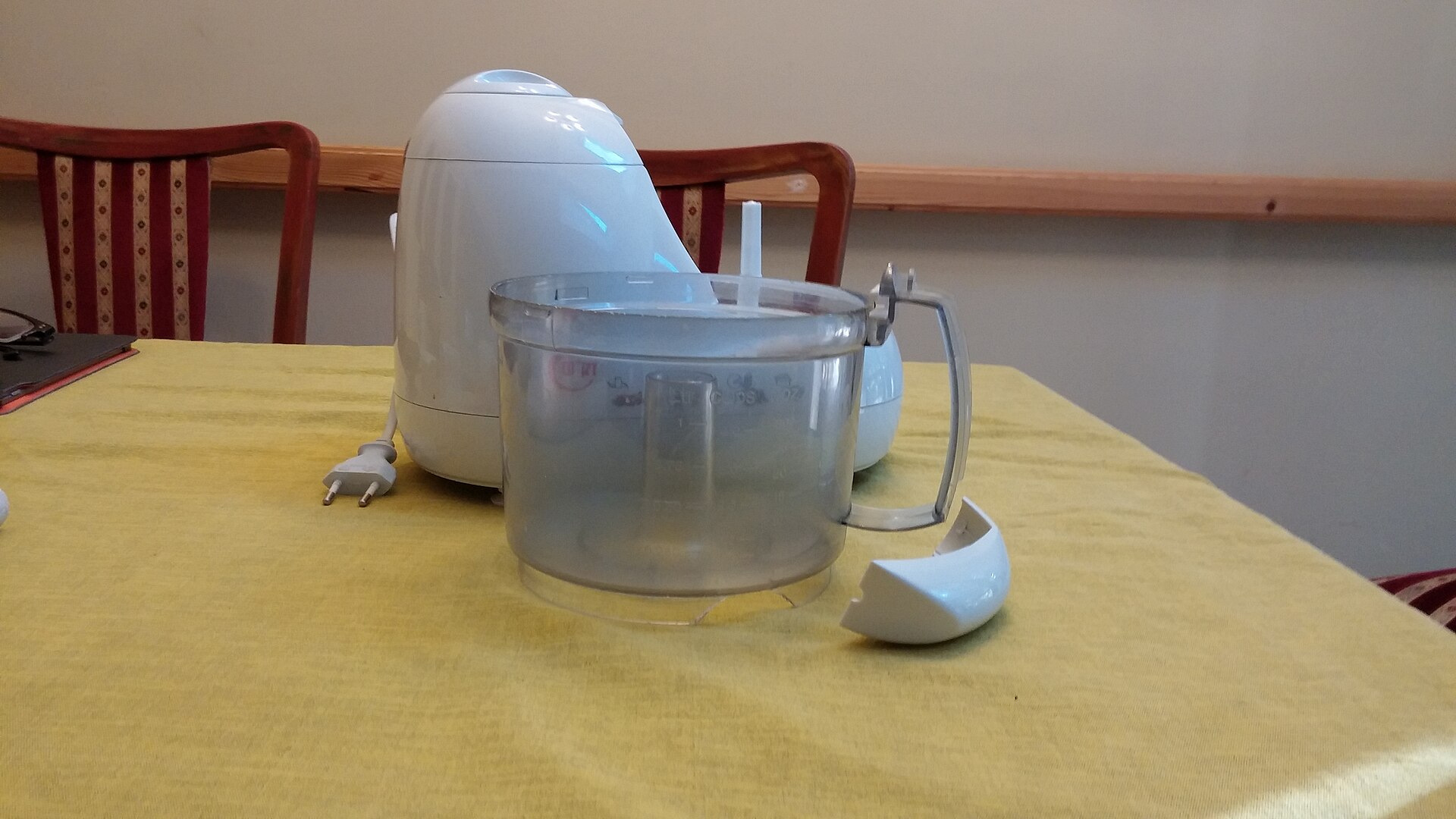 A plastic handle which came loose from the food processor bowl for mini chopper vs food processor: what should you buy?